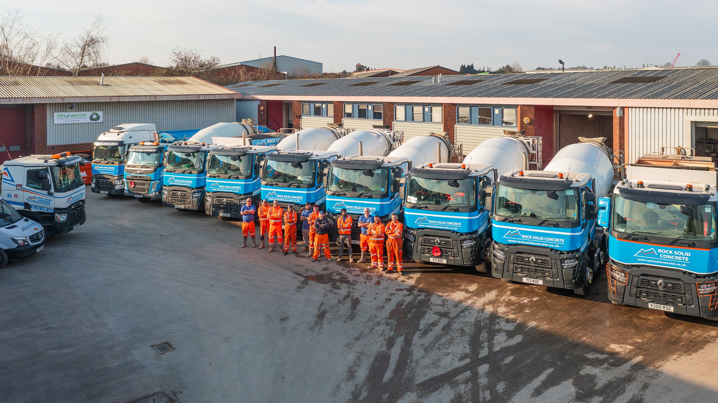 Rock Solid Concrete team with mixer trucks